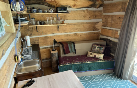 main floor kitchen and couch that can be mattress